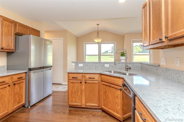 16017 Whippoorwill Ct, Manchester, MI 48158 - kitchen with stainless steel appliances, a peninsula, wood finished floors, light stone countertops, and vaulted ceiling