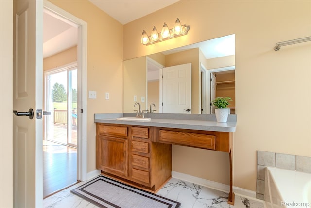 16017 Whippoorwill Ct, Manchester, MI 48158 - bathroom with marble finish flooring, vanity, and a bath