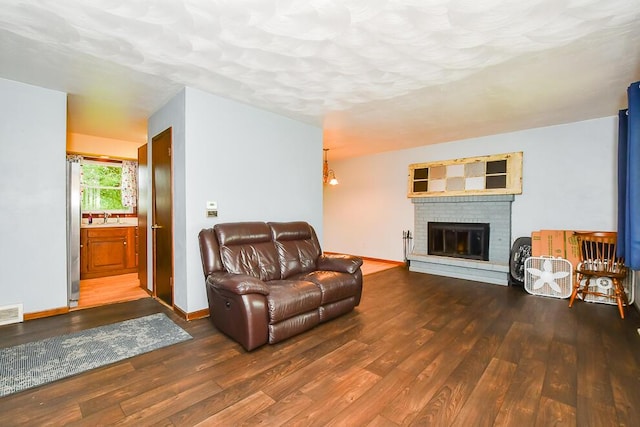 12345 Beadle Lake Rd, Battle Creek, MI 49014 - living room featuring wood finished floors and a brick fireplace