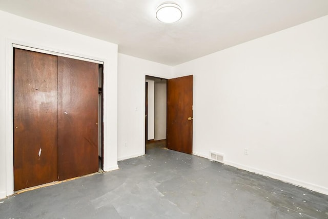 12345 Beadle Lake Rd, Battle Creek, MI 49014 - unfurnished bedroom with concrete flooring and a closet