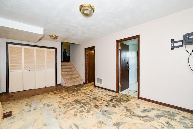 12345 Beadle Lake Rd, Battle Creek, MI 49014 - unfurnished bedroom with baseboards and a closet