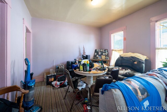 945 Kalamazoo Ave SE, Grand Rapids, MI 49507 - living area featuring healthy amount of natural light and carpet floors