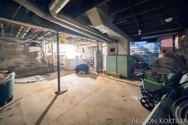 945 Kalamazoo Ave SE, Grand Rapids, MI 49507 - below grade area featuring water heater and independent washer and dryer