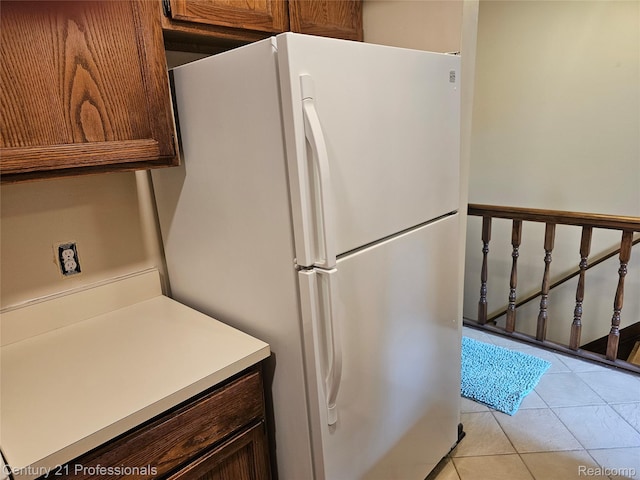 4866 Elm Tree Ln, Warren, MI 48092 - kitchen with freestanding refrigerator, light tile patterned flooring, and light countertops