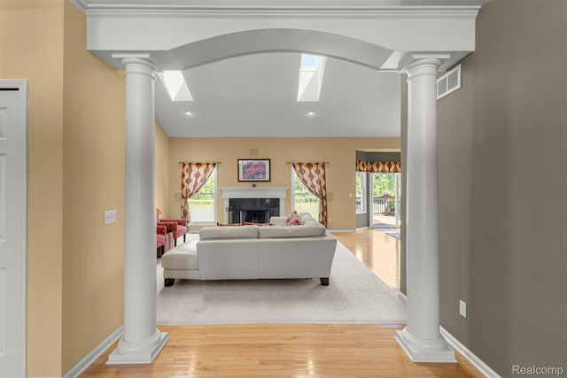 24065 Timber Creek Ln, Flat Rock, MI 48134 - living room with decorative columns, light wood-type flooring, plenty of natural light, and recessed lighting