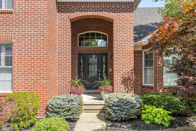 24065 Timber Creek Ln, Flat Rock, MI 48134 - entrance to property featuring brick siding and roof with shingles