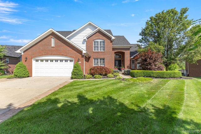 24065 Timber Creek Ln, Flat Rock, MI 48134 - traditional home featuring brick siding, concrete driveway, an attached garage, and a front yard