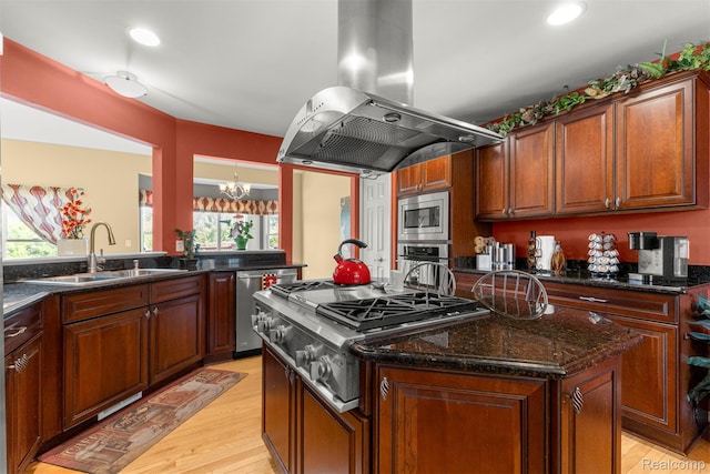 24065 Timber Creek Ln, Flat Rock, MI 48134 - kitchen with island exhaust hood, appliances with stainless steel finishes, healthy amount of natural light, a kitchen island, and recessed lighting