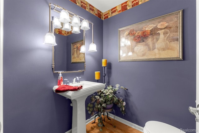 24065 Timber Creek Ln, Flat Rock, MI 48134 - half bath featuring toilet and wood finished floors