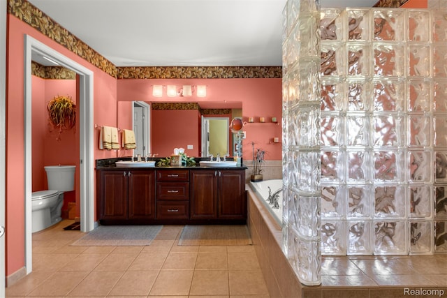 24065 Timber Creek Ln, Flat Rock, MI 48134 - bathroom with double vanity, tile patterned floors, and a garden tub