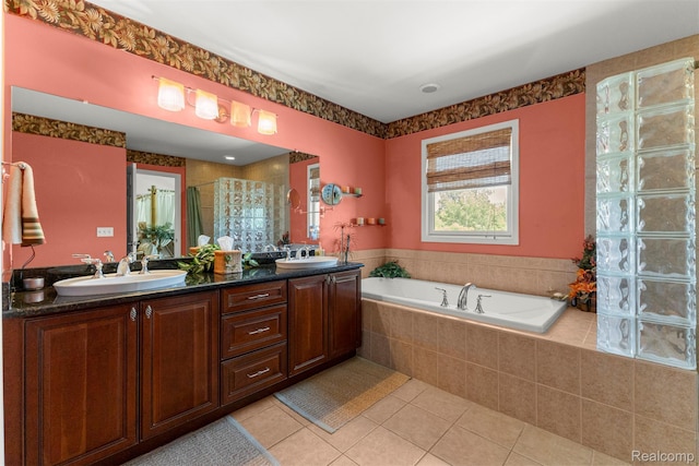 24065 Timber Creek Ln, Flat Rock, MI 48134 - bathroom featuring double vanity, tile patterned flooring, a garden tub, and a shower stall