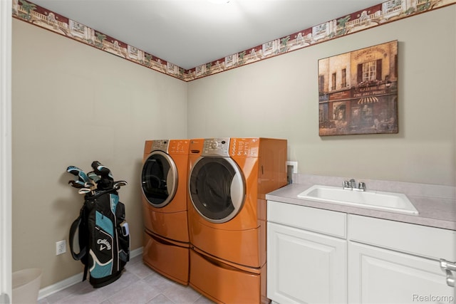 24065 Timber Creek Ln, Flat Rock, MI 48134 - laundry room featuring washing machine and dryer, light tile patterned floors, and cabinet space