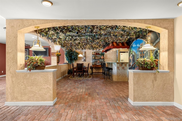 24065 Timber Creek Ln, Flat Rock, MI 48134 - dining space featuring brick flooring and arched walkways