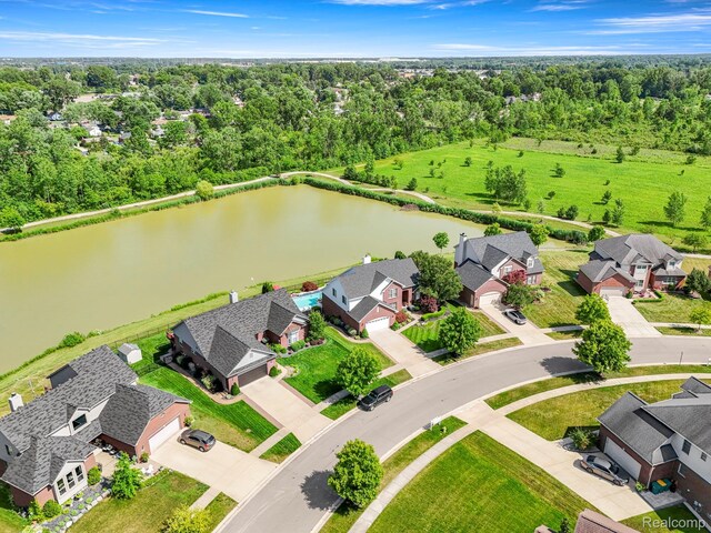 24065 Timber Creek Ln, Flat Rock, MI 48134 - aerial perspective of suburban area featuring a nearby body of water and a tree filled landscape