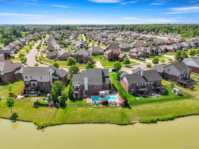24065 Timber Creek Ln, Flat Rock, MI 48134 - aerial view of residential area featuring a pool area and a large body of water