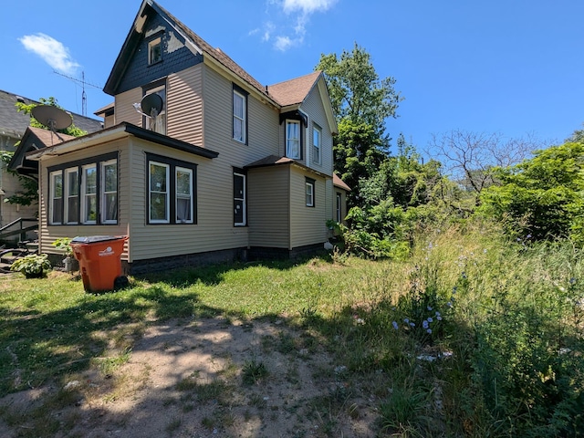 650 Pavone St, Benton Harbor, MI 49022 - view of home's exterior featuring a yard