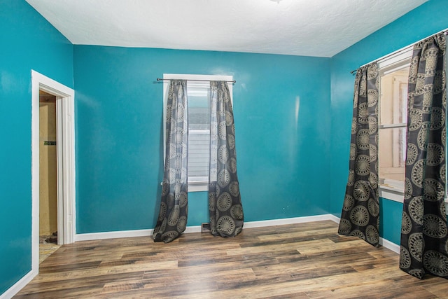 404 Susan Ave, Sturgis, MI 49091 - unfurnished room with wood finished floors and baseboards
