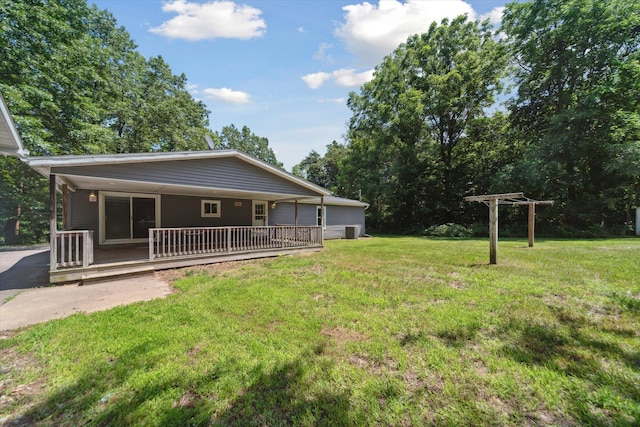 19905 N Ave, Battle Creek, MI 49017 - rear view of house with a yard and a wooden deck