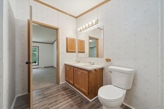 19905 N Ave, Battle Creek, MI 49017 - bathroom featuring crown molding, wood finished floors, and double vanity