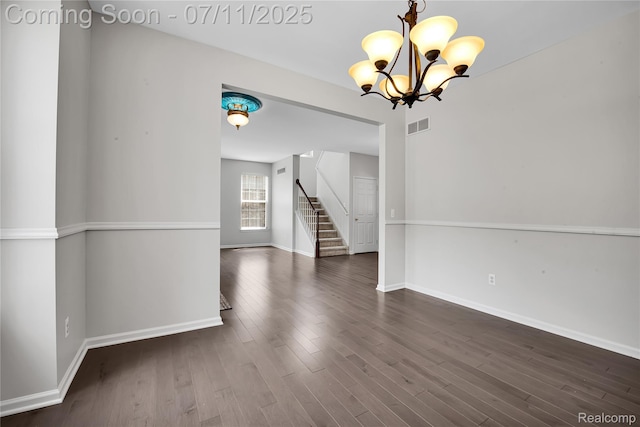 3454 Everett Dr, Rochester Hills, MI 48307 - spare room with dark wood-style floors, a chandelier, and stairway