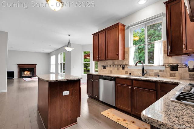 3454 Everett Dr, Rochester Hills, MI 48307 - kitchen featuring appliances with stainless steel finishes, backsplash, a center island, wood finished floors, and recessed lighting