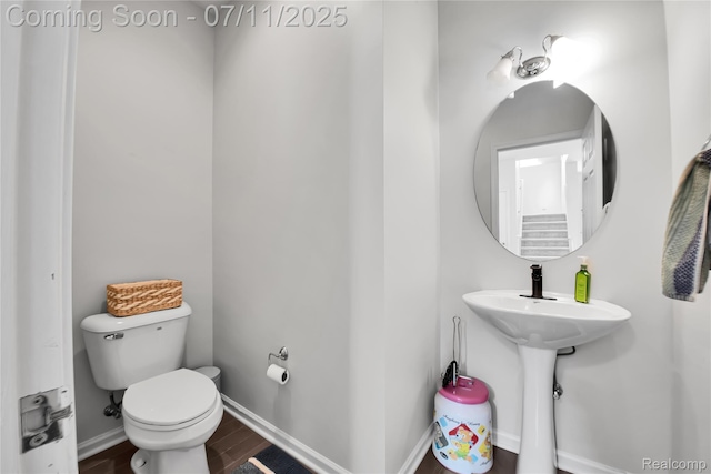 3454 Everett Dr, Rochester Hills, MI 48307 - half bath featuring toilet and wood finished floors