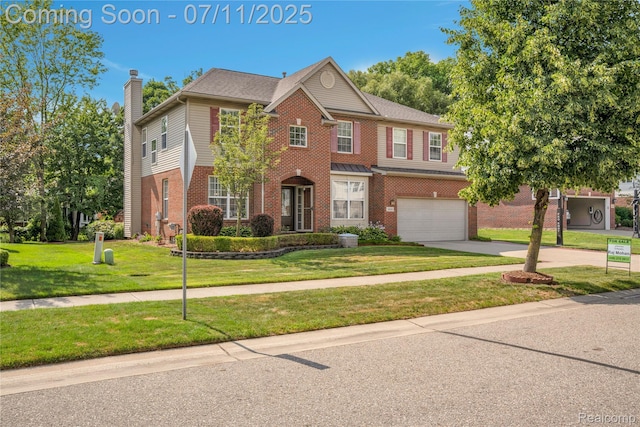 3454 Everett Dr, Rochester Hills, MI 48307 - view of front of house featuring a chimney, a garage, brick siding, driveway, and a front yard