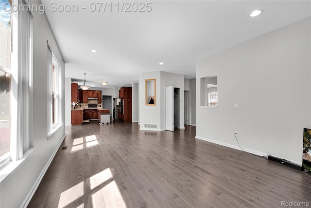 3454 Everett Dr, Rochester Hills, MI 48307 - unfurnished living room with dark wood-style floors and recessed lighting