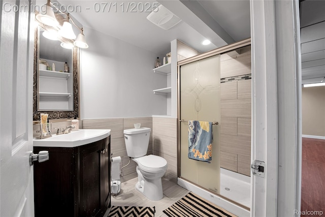 3454 Everett Dr, Rochester Hills, MI 48307 - full bath with vanity, tile walls, a shower stall, a wainscoted wall, and recessed lighting