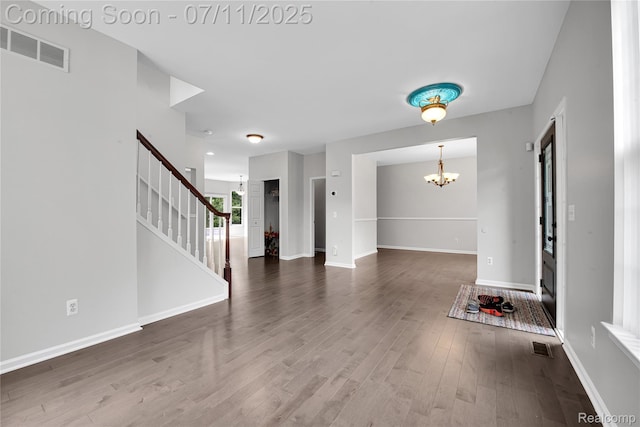 3454 Everett Dr, Rochester Hills, MI 48307 - foyer entrance featuring a chandelier, stairs, and wood finished floors