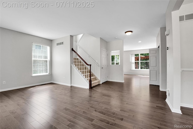 3454 Everett Dr, Rochester Hills, MI 48307 - unfurnished living room featuring dark wood-style floors and stairway
