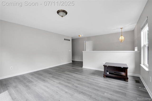 3454 Everett Dr, Rochester Hills, MI 48307 - unfurnished room with healthy amount of natural light and wood finished floors