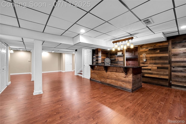 3454 Everett Dr, Rochester Hills, MI 48307 - unfurnished living room featuring dark wood finished floors, stairway, and a drop ceiling