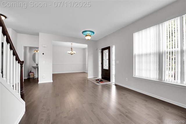 3454 Everett Dr, Rochester Hills, MI 48307 - foyer with a chandelier, stairway, and dark wood-type flooring