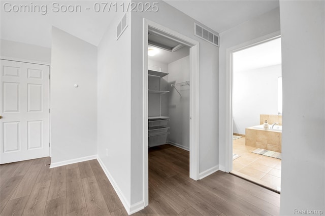 3454 Everett Dr, Rochester Hills, MI 48307 - hall featuring wood finished floors and baseboards