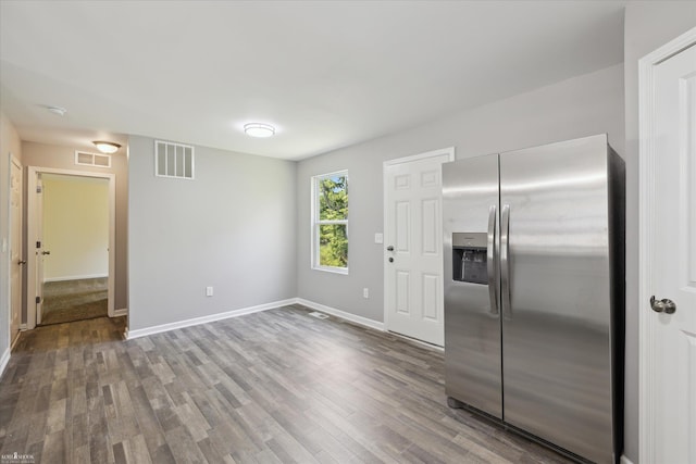180 Ash St, Corunna, MI 48817 - kitchen with stainless steel refrigerator with ice dispenser and wood finished floors