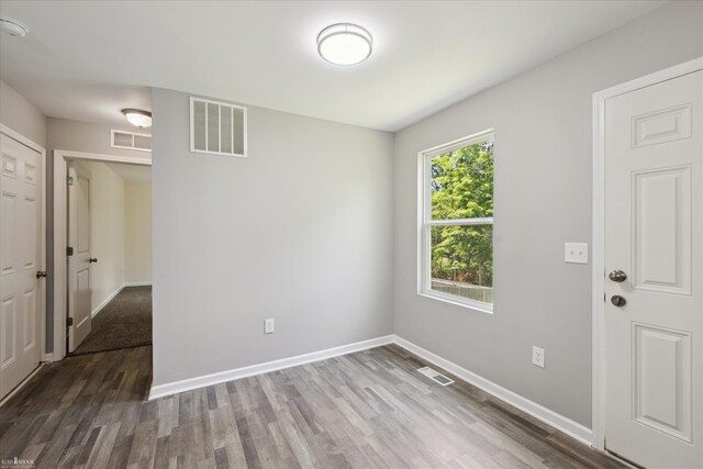 180 Ash St, Corunna, MI 48817 - unfurnished room featuring wood finished floors and a smoke detector