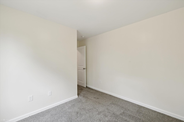 180 Ash St, Corunna, MI 48817 - carpeted spare room featuring baseboards