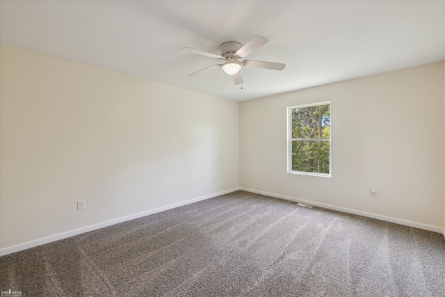 180 Ash St, Corunna, MI 48817 - spare room featuring a ceiling fan and carpet