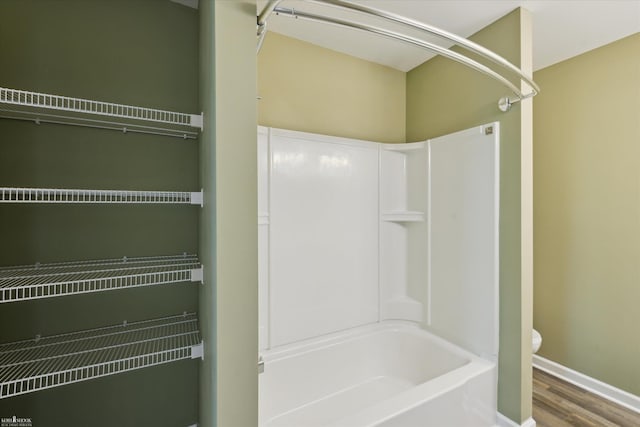 180 Ash St, Corunna, MI 48817 - full bathroom with shower / bath combination and wood finished floors