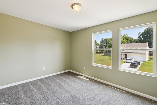 180 Ash St, Corunna, MI 48817 - carpeted empty room with baseboards