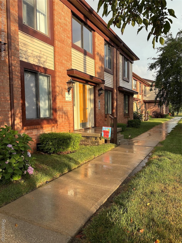 1975 Michigan Ave Unit 47, Marysville, MI 48040 - view of front of home with brick siding and a front yard