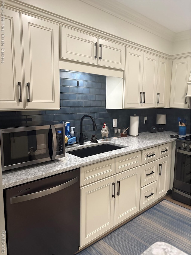1975 Michigan Ave Unit 47, Marysville, MI 48040 - kitchen featuring appliances with stainless steel finishes, decorative backsplash, crown molding, and white cabinetry