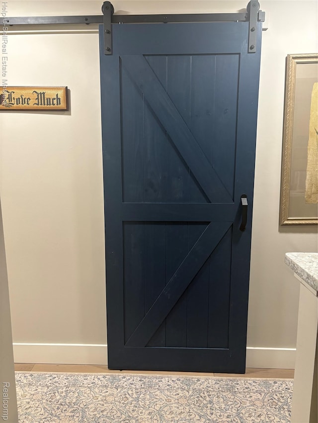 1975 Michigan Ave Unit 47, Marysville, MI 48040 - detailed view of wood finished floors and a barn door