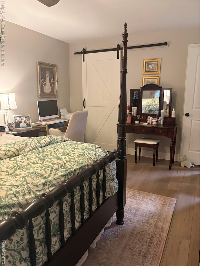 1975 Michigan Ave Unit 47, Marysville, MI 48040 - bedroom with light wood finished floors and a barn door