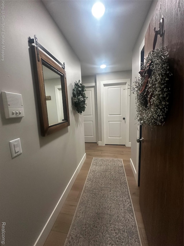 1975 Michigan Ave Unit 47, Marysville, MI 48040 - hall with wood finished floors and a barn door