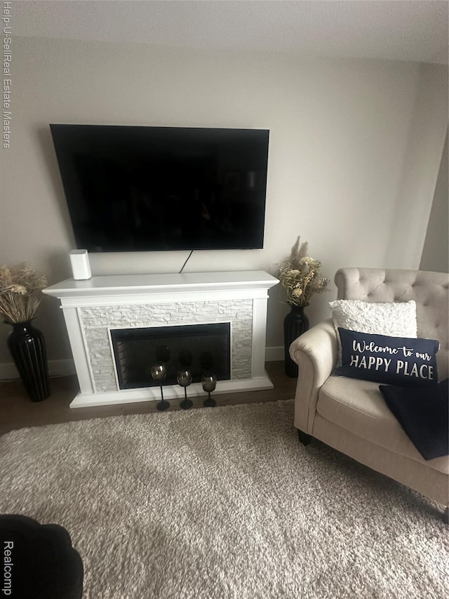 1975 Michigan Ave Unit 47, Marysville, MI 48040 - living area featuring a fireplace with raised hearth and carpet floors