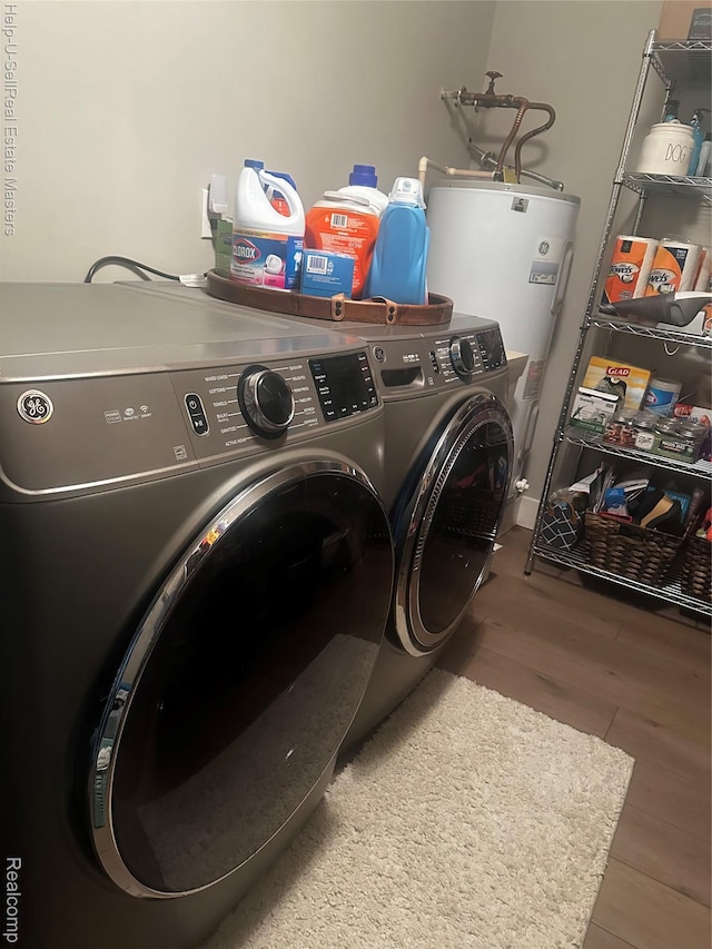 1975 Michigan Ave Unit 47, Marysville, MI 48040 - laundry room featuring water heater, washing machine and dryer, and wood finished floors