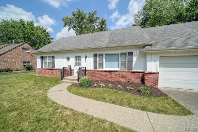 608 Brook St, Tecumseh, MI 49286 - view of front of property featuring brick siding, board and batten siding, a garage, a front lawn, and a chimney