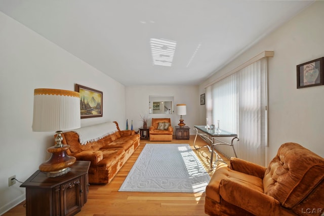 608 Brook St, Tecumseh, MI 49286 - living room featuring light wood-style flooring and baseboards